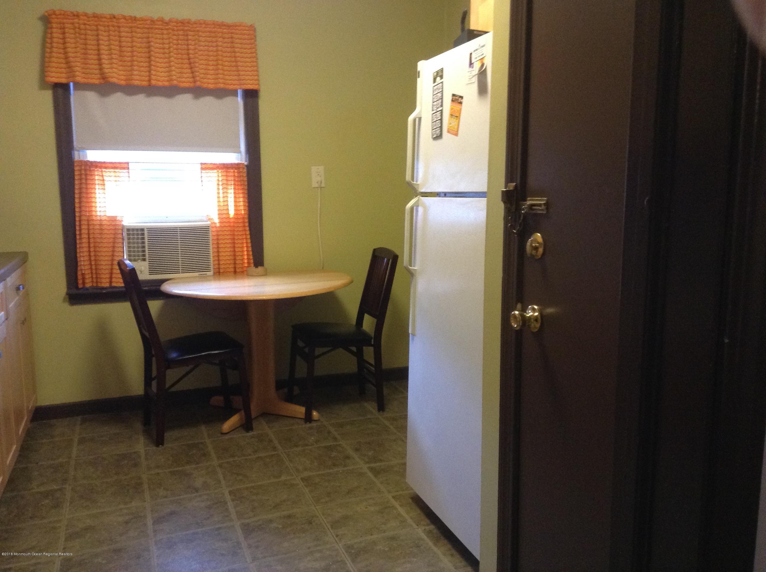 22 Pinckney Road, Unit C Red Bank, NJ 07701 - Photo 6 of 13 a dining room with furniture and a window