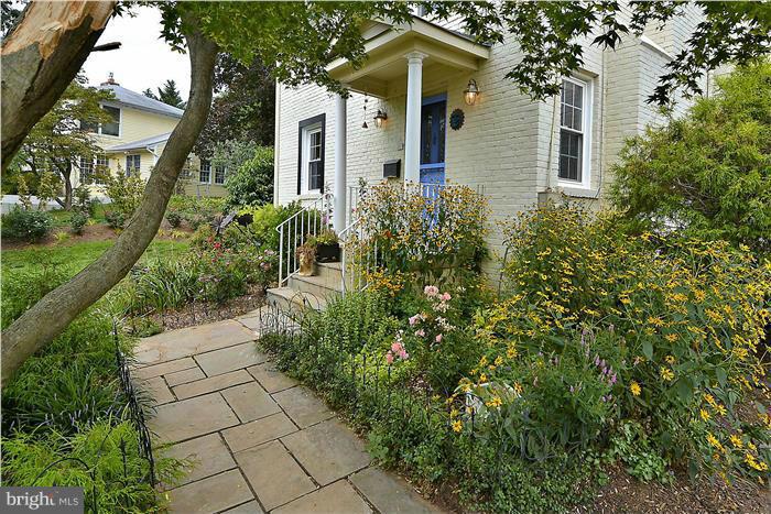 8731 Ridge Road Bethesda, MD 20817 - Photo 2 of 29 front view of a house with a yard