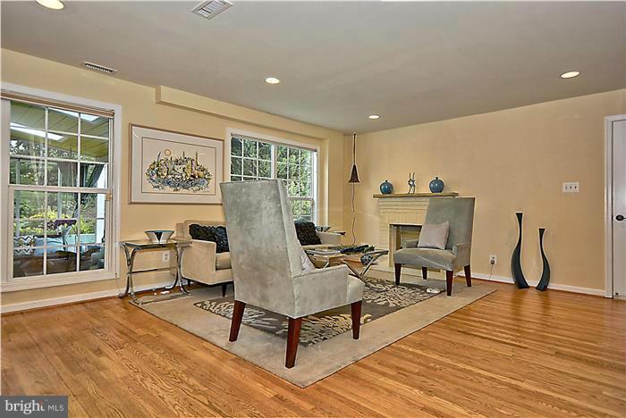 8731 Ridge Road Bethesda, MD 20817 - Photo 13 of 29 a living room with furniture a window and wooden floor