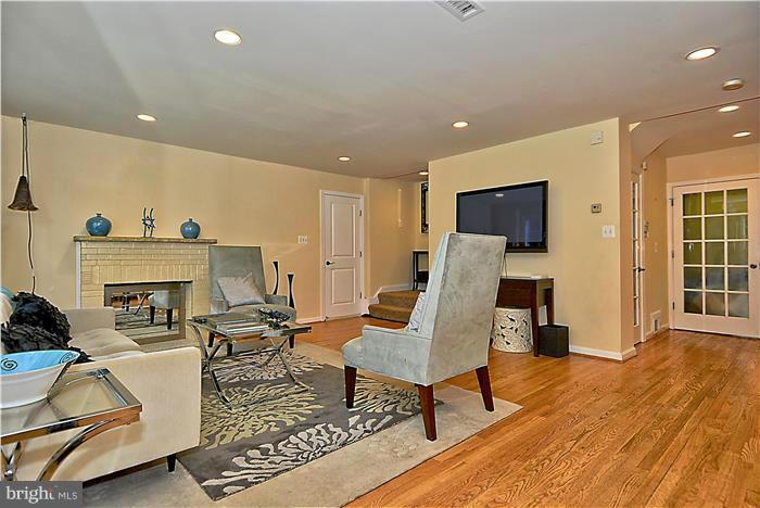 8731 Ridge Road Bethesda, MD 20817 - Photo 15 of 29 a living room with furniture and a fireplace