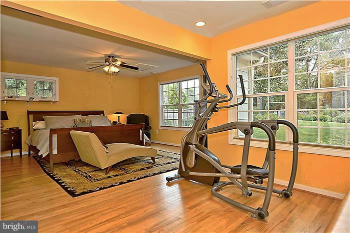 8731 Ridge Road Bethesda, MD 20817 - Photo 17 of 29 a view of a swimming pool with a table and chairs