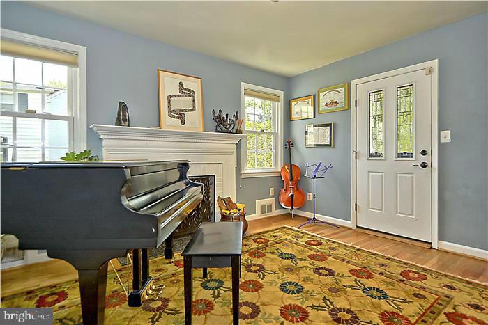 8731 Ridge Road Bethesda, MD 20817 - Photo 6 of 29 a living room with furniture a flat screen tv and a window