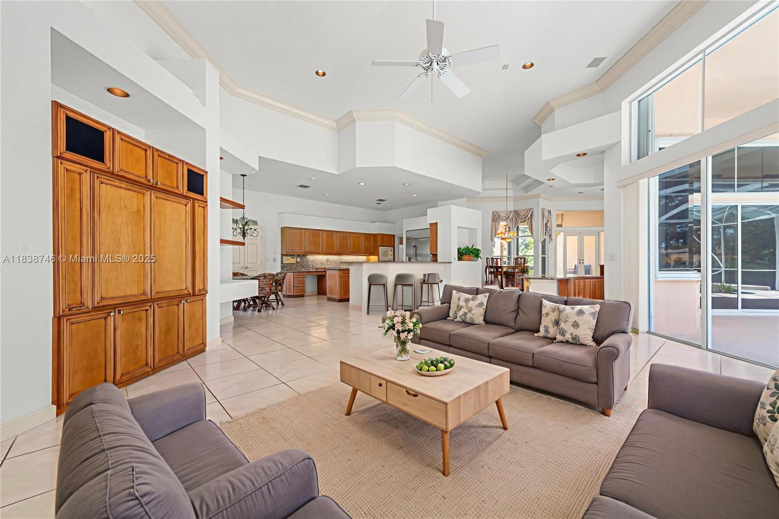 3833 Pine Lake Drive Weston, FL 33332 - Photo 20 of 46 a living room with furniture kitchen view and a window