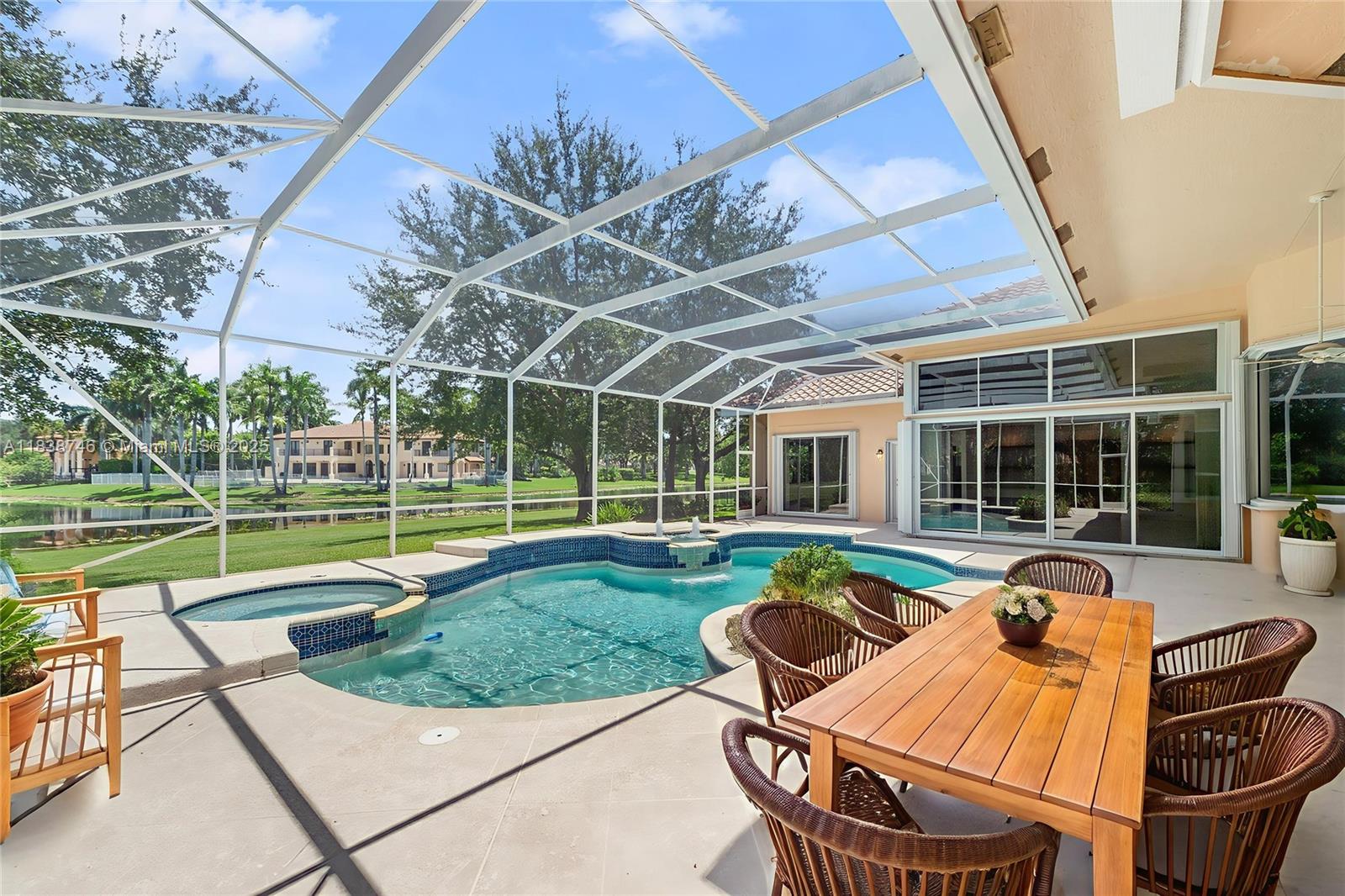 3833 Pine Lake Drive Weston, FL 33332 - Photo 39 of 46 a view of a house with swimming pool and sitting area