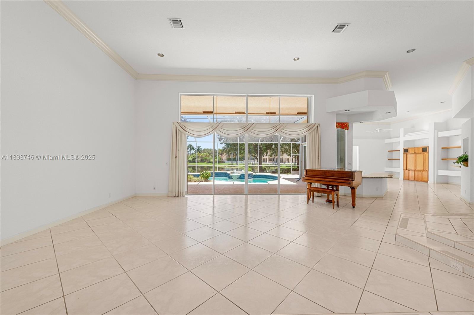 3833 Pine Lake Drive Weston, FL 33332 - Photo 5 of 46 a view of an empty room with a window
