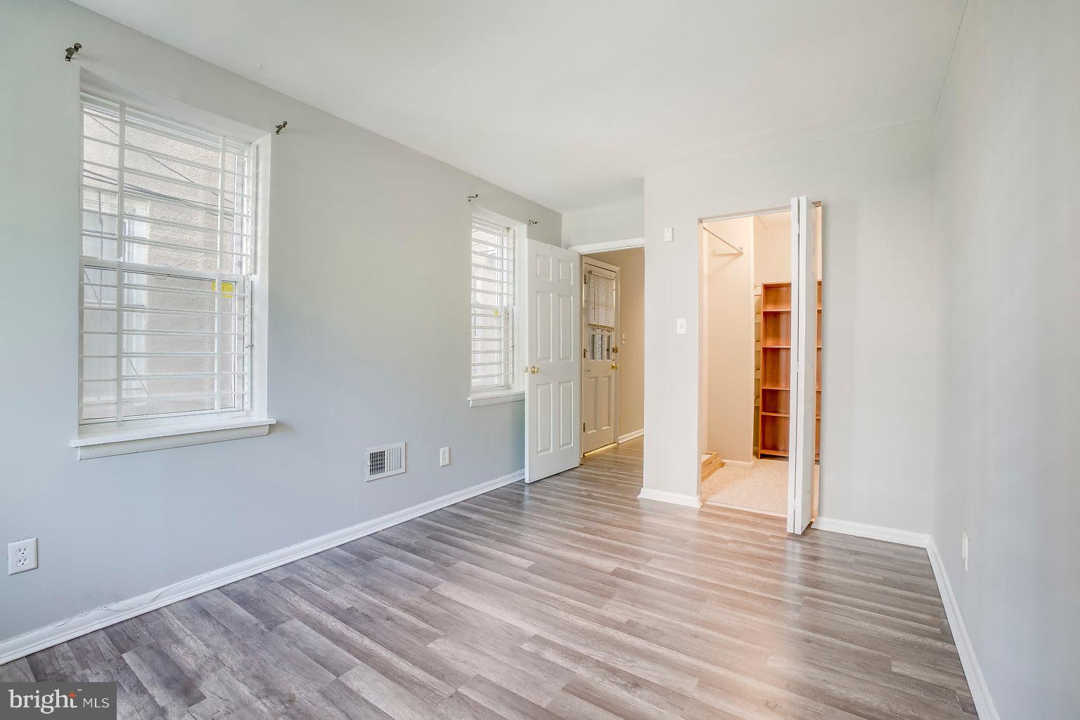 1522 East Baltimore Street, Unit 1 Baltimore, MD 21231 - Photo 20 of 26 a view of an empty room with wooden floor and a window