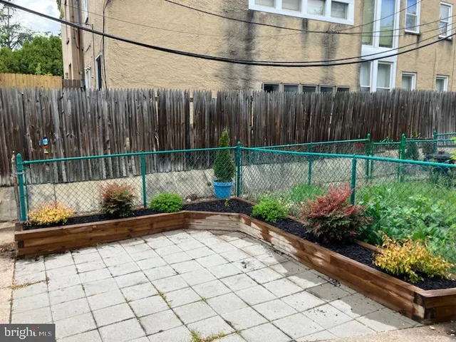 a view of a backyard with sitting area