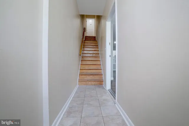 a view of a hallway with stairs