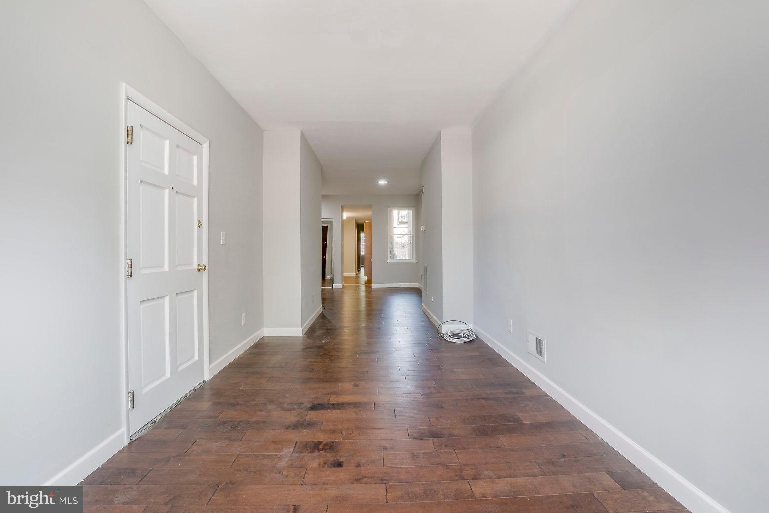 1522 East Baltimore Street, Unit 1 Baltimore, MD 21231 - Photo 9 of 26 a view of a hallway with wooden floor