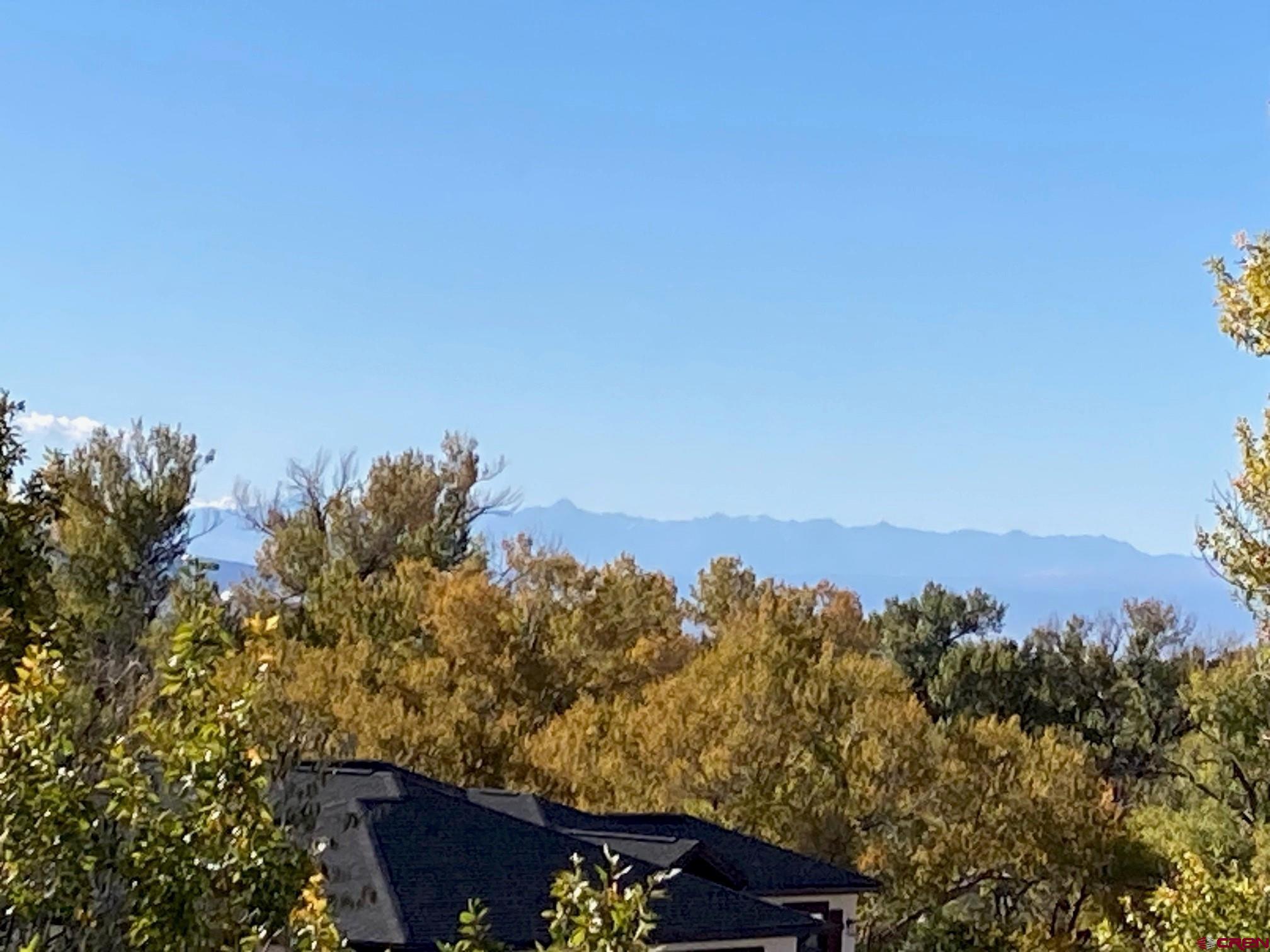1590 Southeast 3rd Street Cedaredge, CO 81413 - Photo 17 of 26 an aerial view of a house with a mountain view