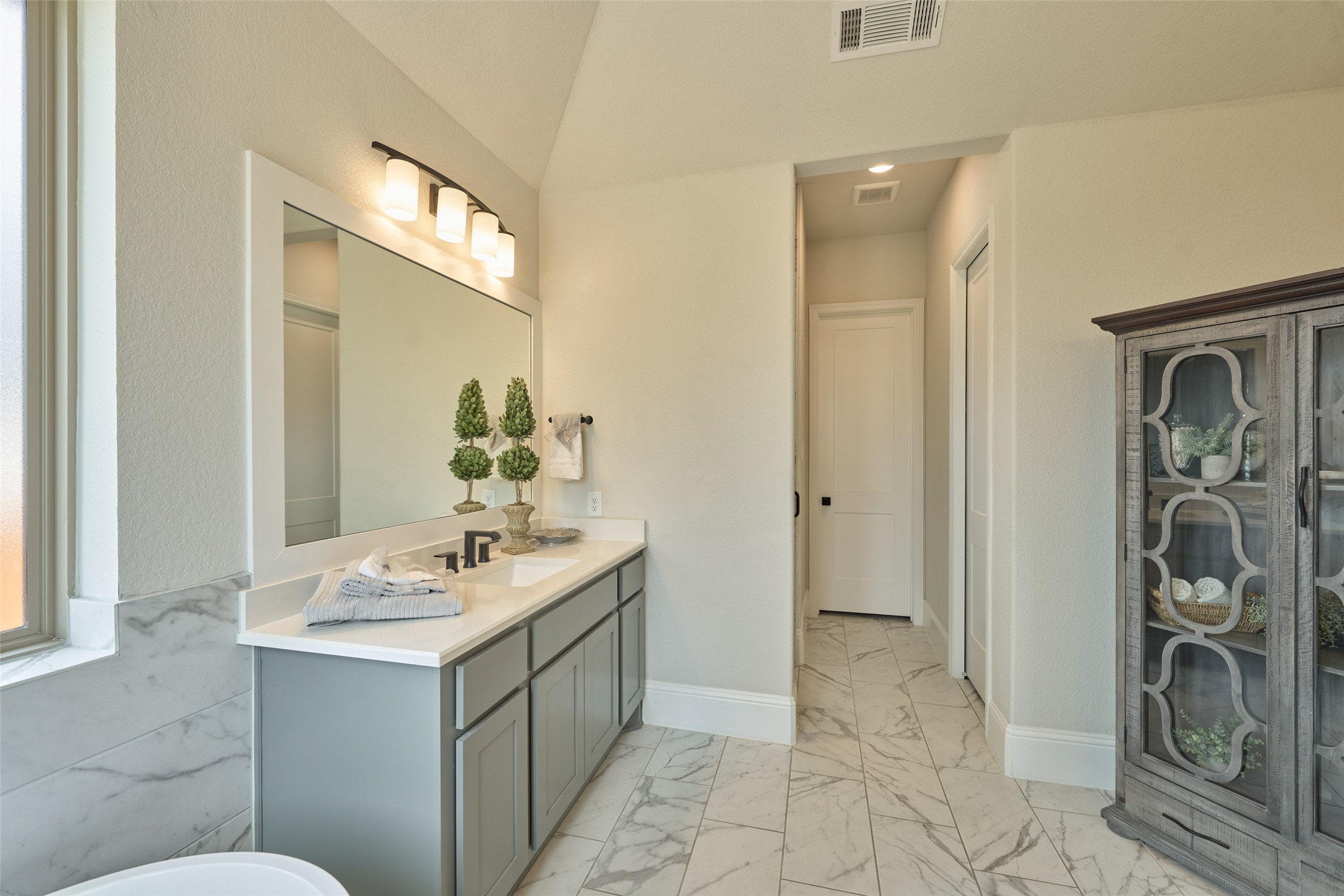 10090 South Goshawk Trail Conroe, TX 77385 - Photo 22 of 43 Shower offering privacy located just inside the hall on left with separate toilet to the right. Large closet is straight ahead.