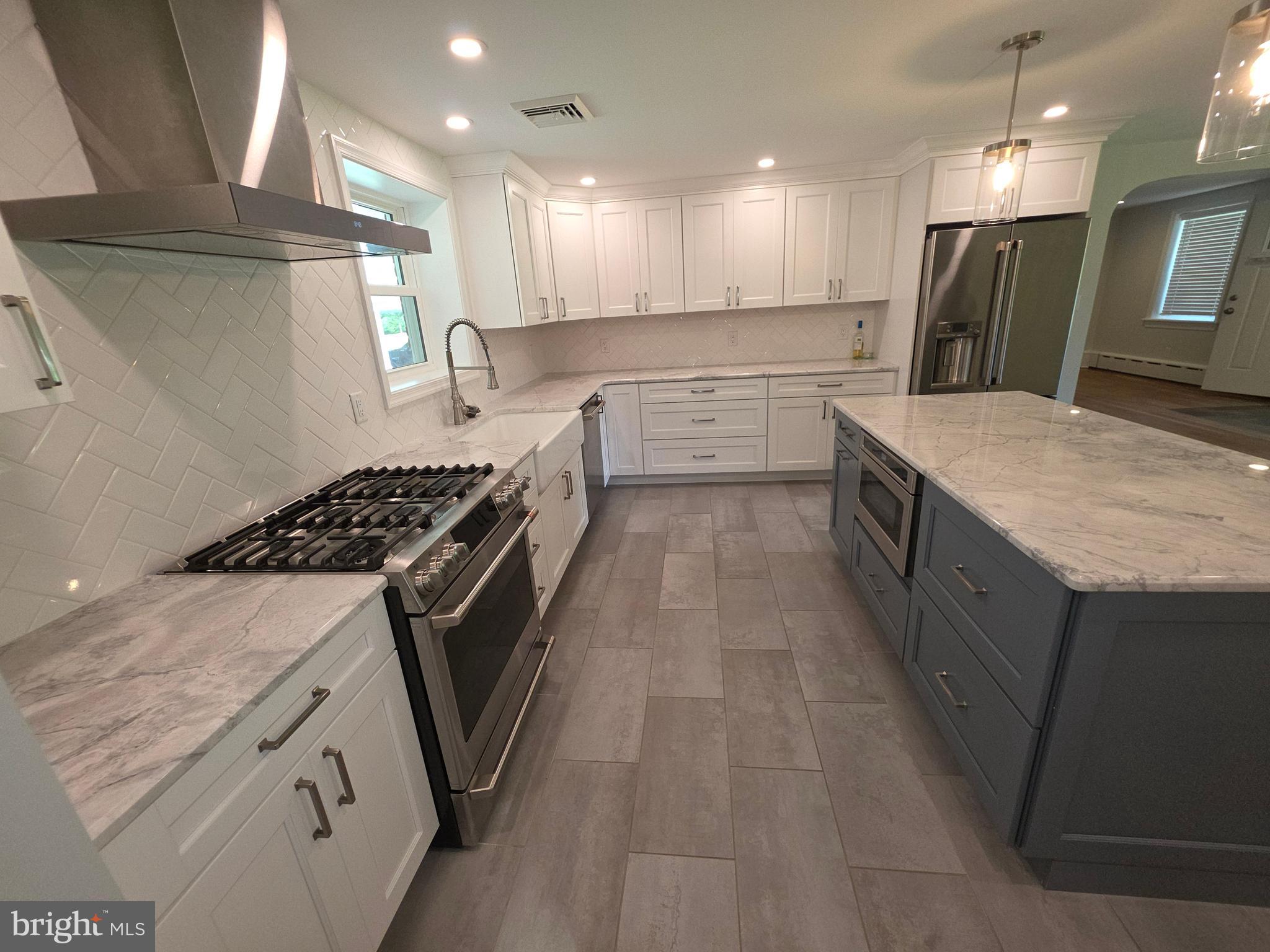 139 Mattson Road Garnet Valley, PA 19060 - Photo 12 of 61 a kitchen with a sink stove and cabinets