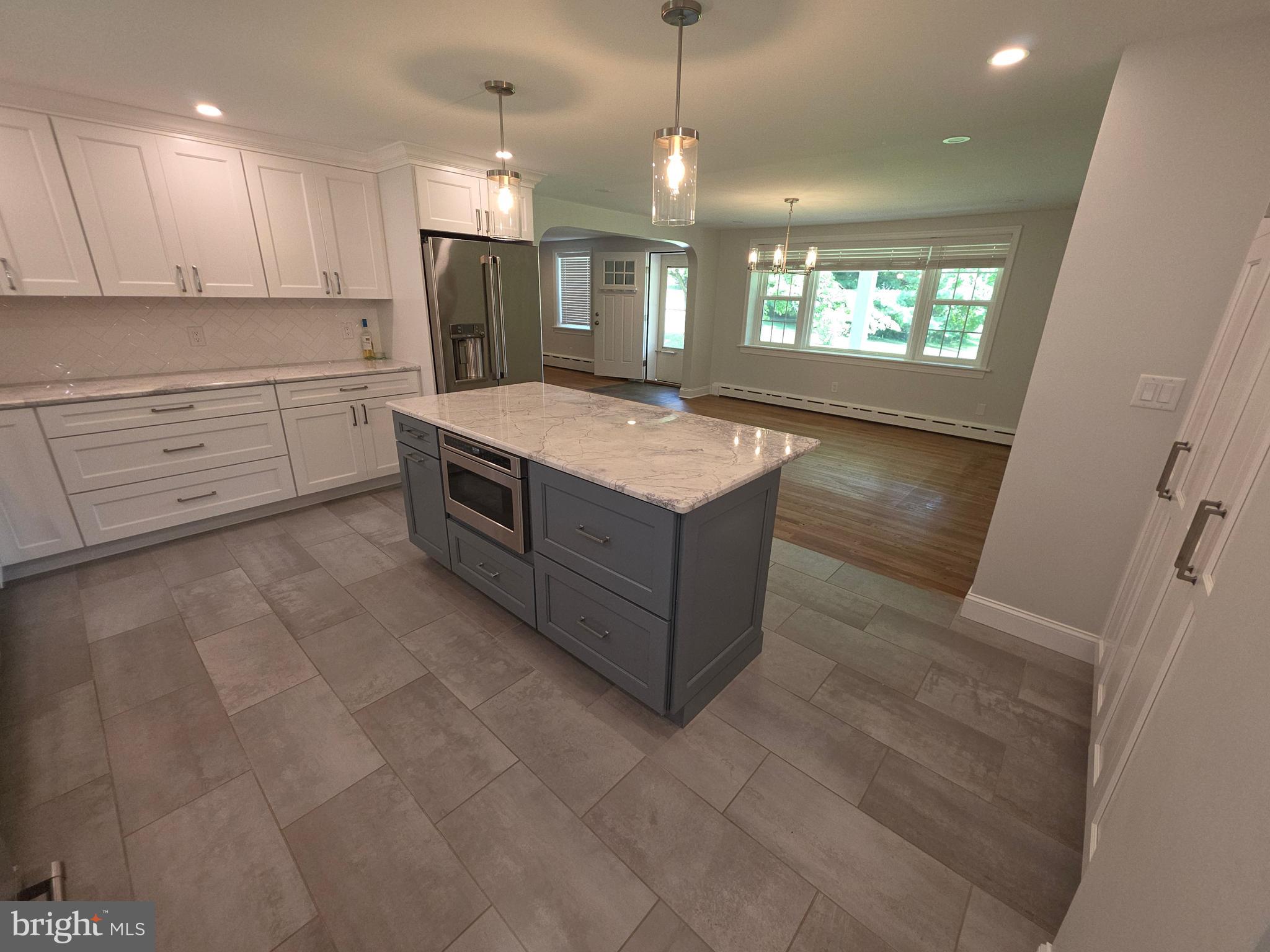 139 Mattson Road Garnet Valley, PA 19060 - Photo 14 of 61 a kitchen with stainless steel appliances granite countertop a stove a sink and a refrigerator
