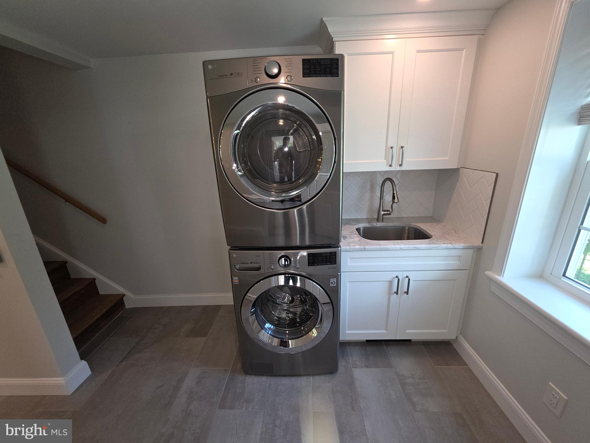 139 Mattson Road Garnet Valley, PA 19060 - Photo 15 of 61 a utility room with sink dryer and washer