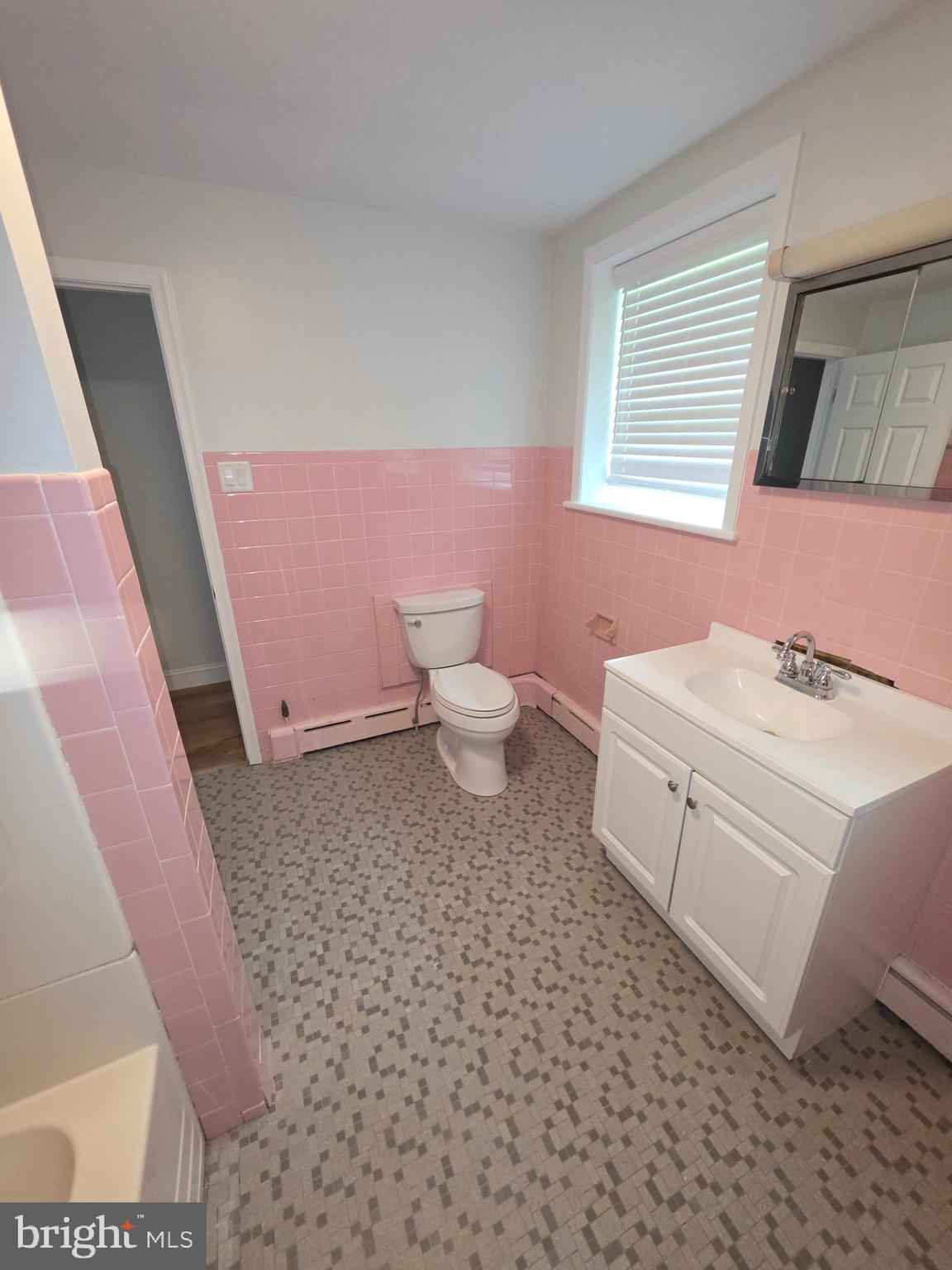 139 Mattson Road Garnet Valley, PA 19060 - Photo 22 of 61 a bathroom with a sink a toilet and a mirror