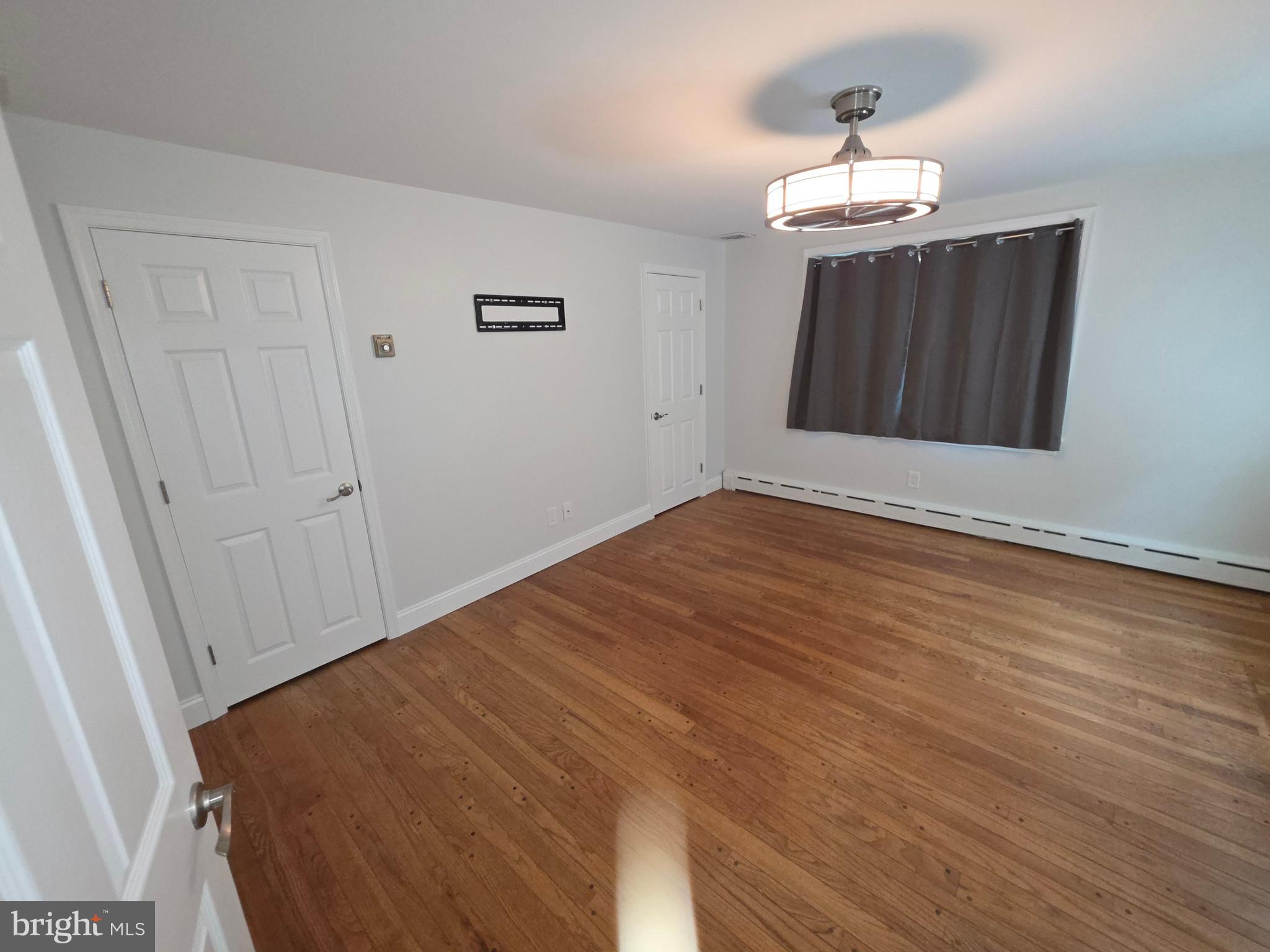 139 Mattson Road Garnet Valley, PA 19060 - Photo 35 of 61 a view of an empty room with wooden floor