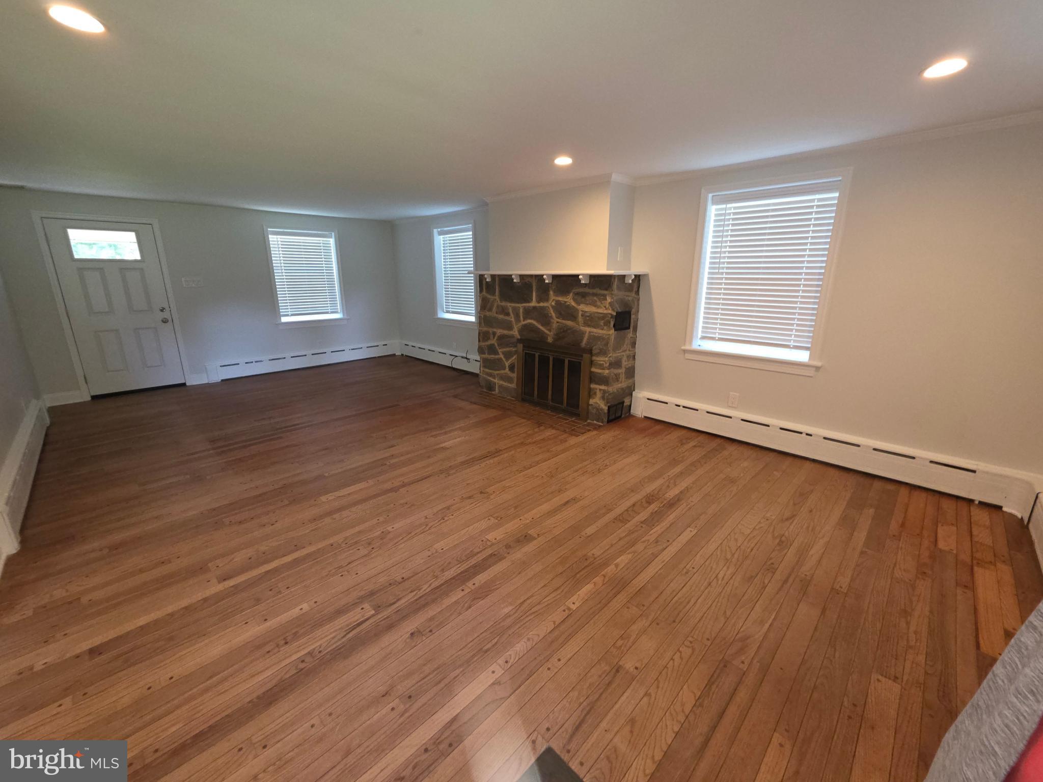 139 Mattson Road Garnet Valley, PA 19060 - Photo 46 of 61 an empty room with wooden floor and windows
