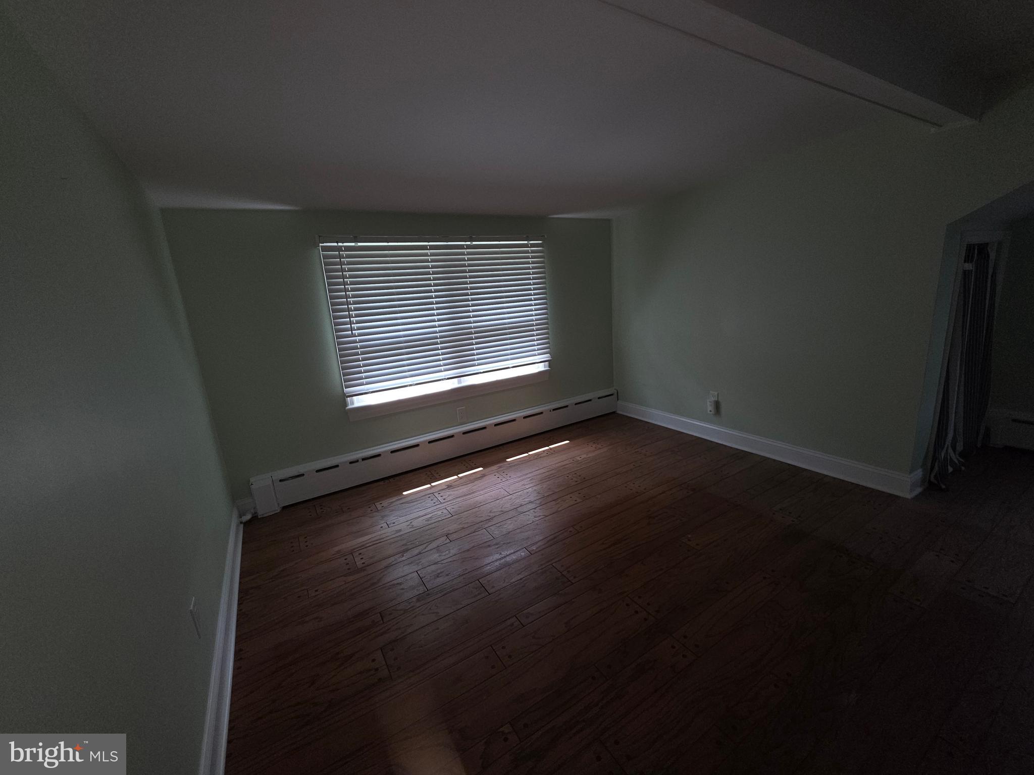 139 Mattson Road Garnet Valley, PA 19060 - Photo 48 of 61 a view of an empty room with wooden floor and a window