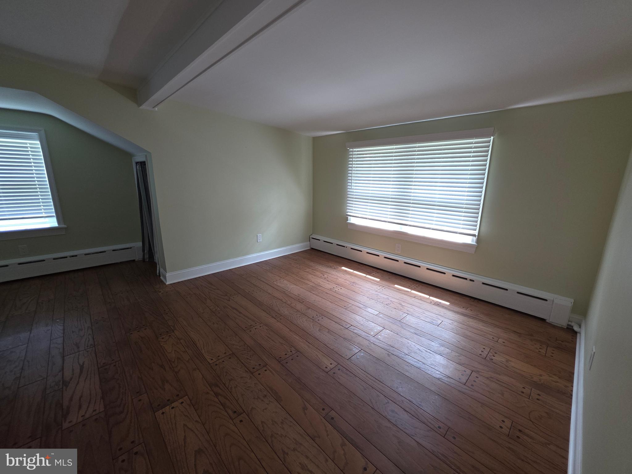 139 Mattson Road Garnet Valley, PA 19060 - Photo 52 of 61 an empty room with wooden floor and windows