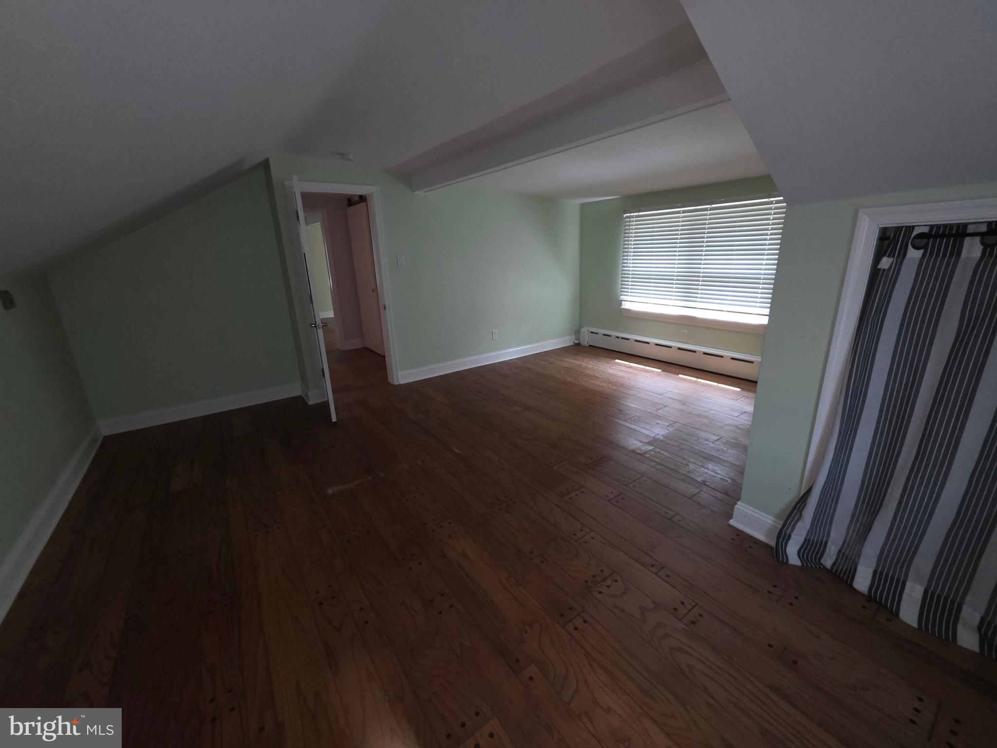 139 Mattson Road Garnet Valley, PA 19060 - Photo 53 of 61 an empty room with wooden floor and windows