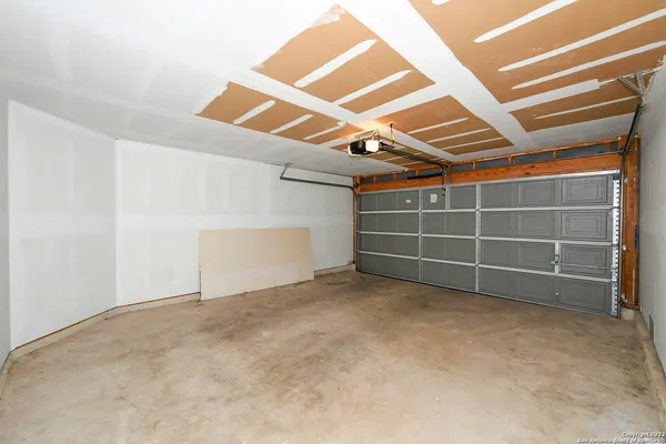 an empty room with a empty space and windows