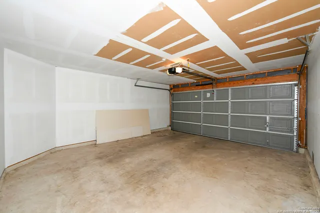 an empty room with a empty space and windows