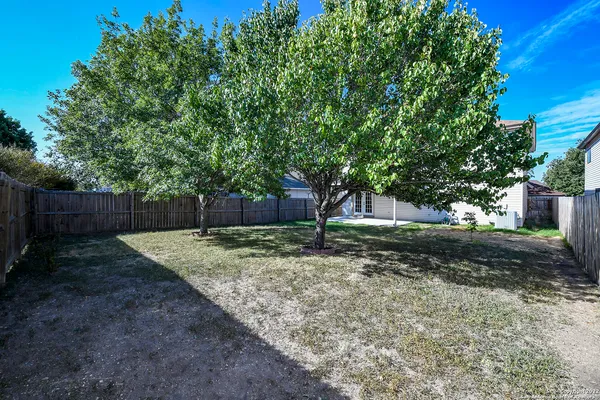 a backyard of a house with lots of green space