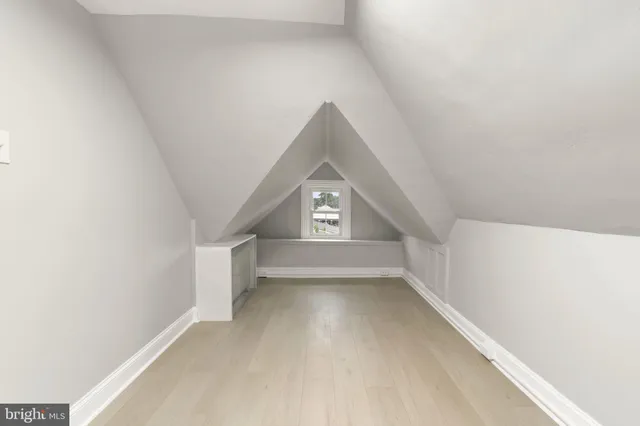 a view of a hallway with a window