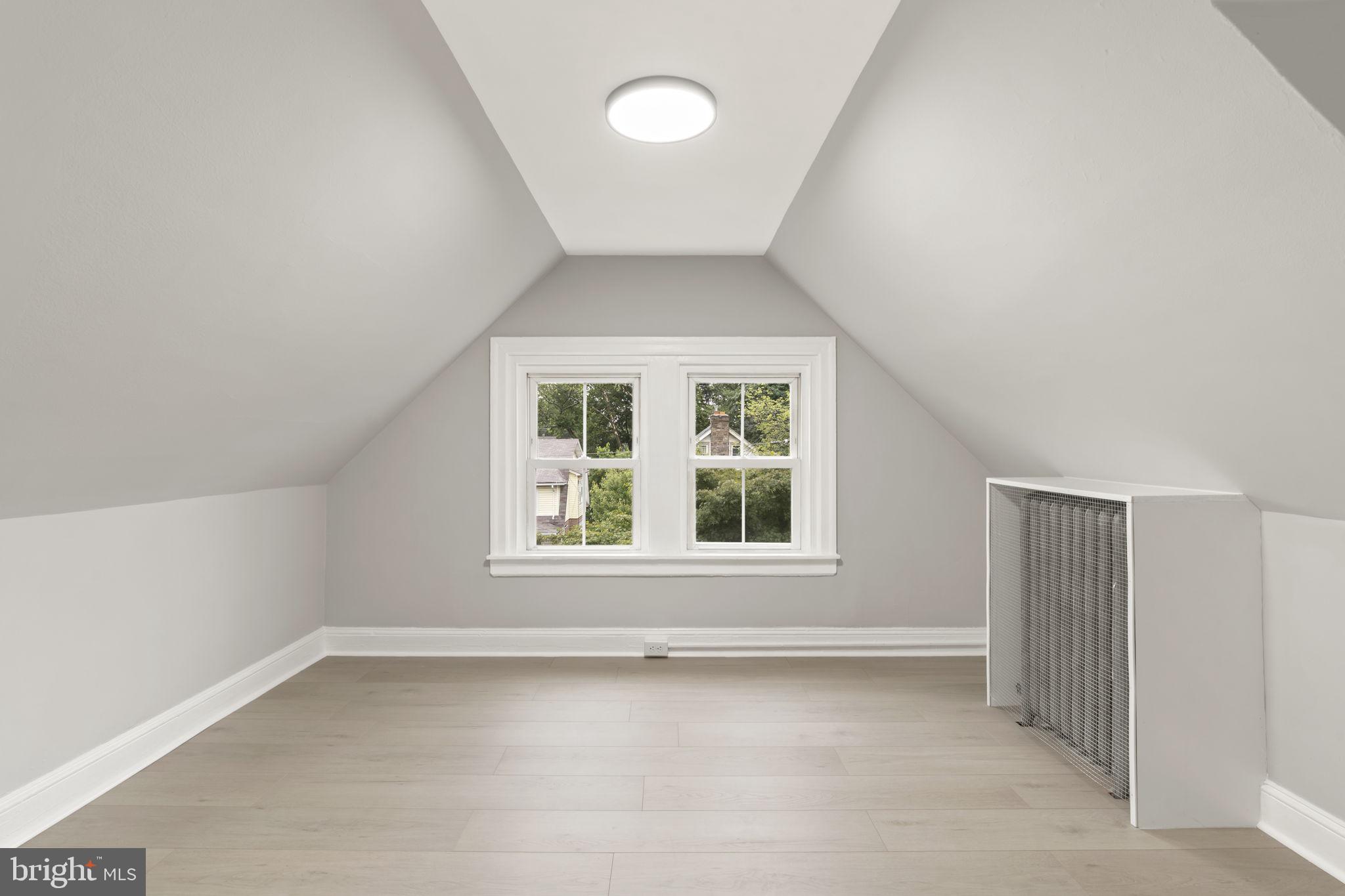 216 Collingdale Avenue, Unit 5 Collingdale, PA 19023 - Photo 2 of 12 an empty room with a window