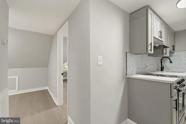 a bathroom with a sink and mirror