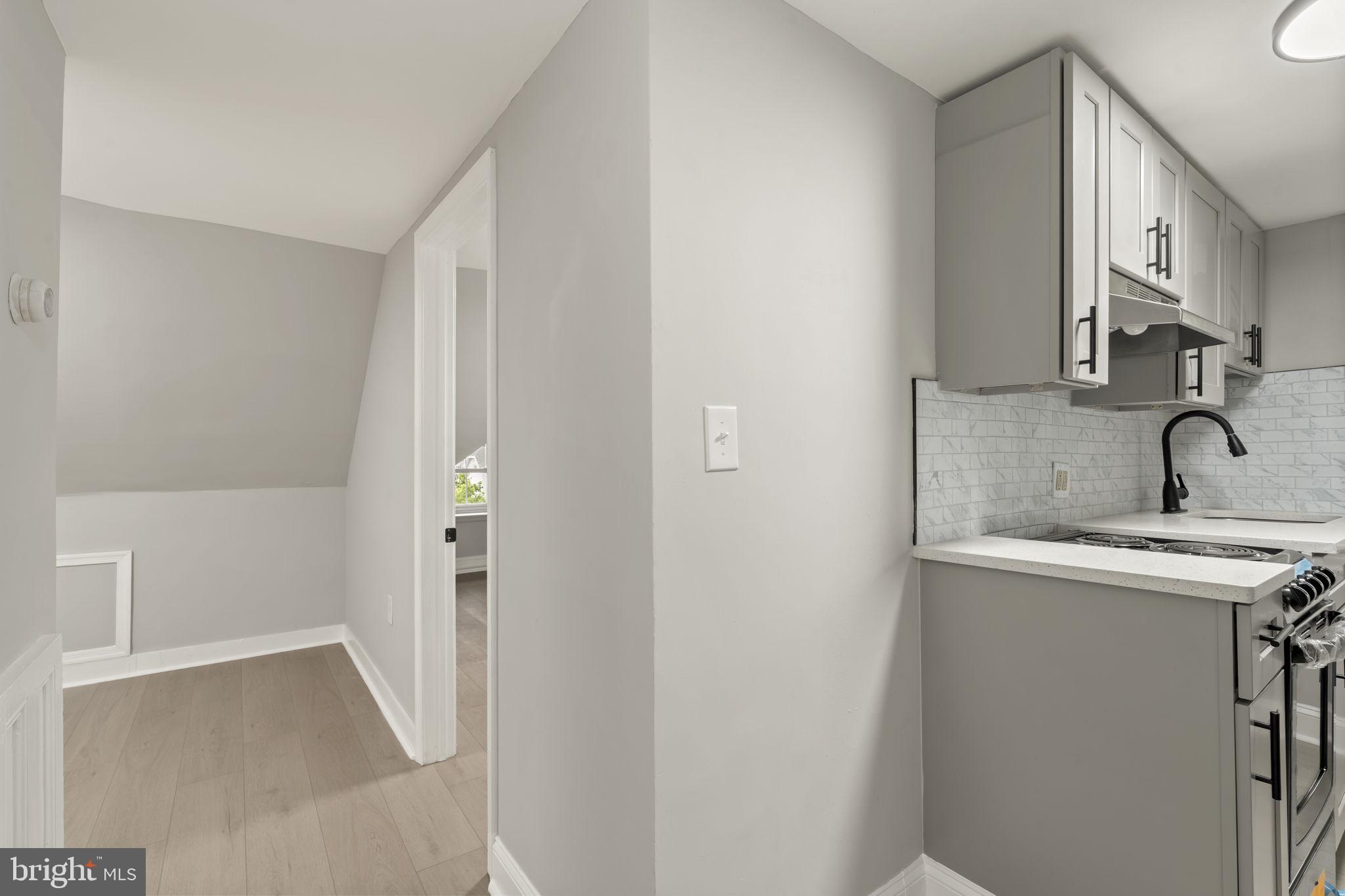 216 Collingdale Avenue, Unit 5 Collingdale, PA 19023 - Photo 4 of 12 a bathroom with a sink and mirror