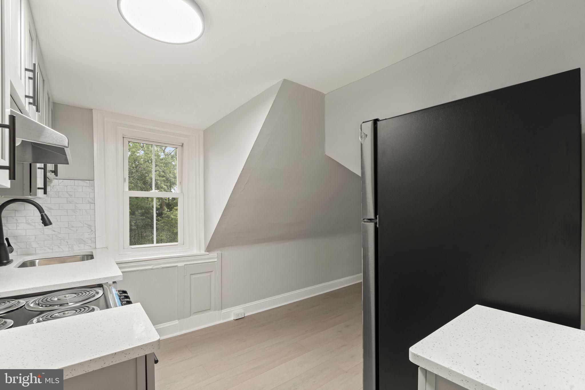 216 Collingdale Avenue, Unit 5 Collingdale, PA 19023 - Photo 5 of 12 a bathroom with a sink toilet and shower