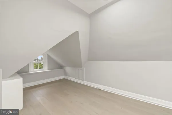 a view of an empty room with windows