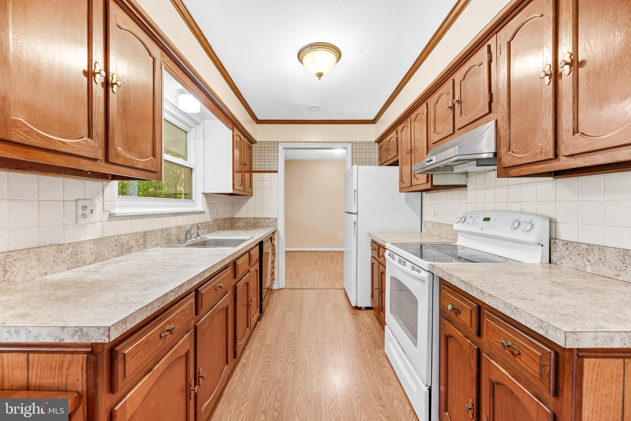 1730 Holland Cliffs Road Huntingtown, MD 20639 - Photo 14 of 46 Over the Sink window allows natural light in