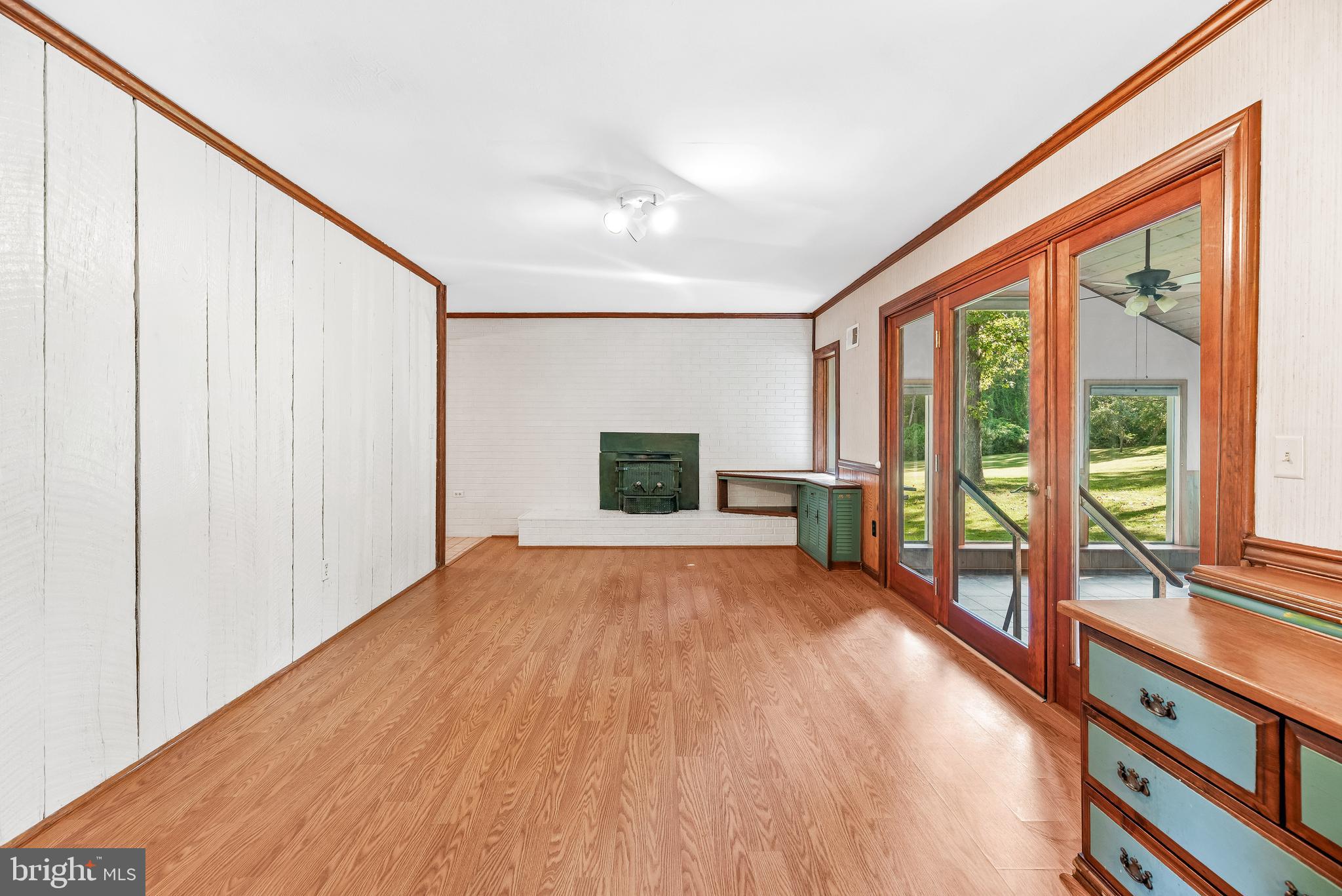 1730 Holland Cliffs Road Huntingtown, MD 20639 - Photo 15 of 46 Family Room w/ wood panel accent wall