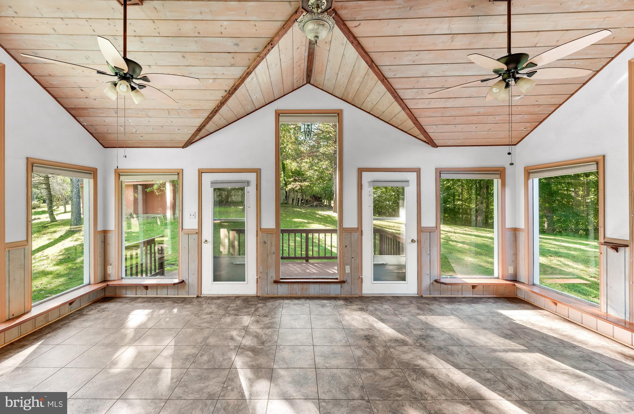 1730 Holland Cliffs Road Huntingtown, MD 20639 - Photo 19 of 46 Cathedral Ceilings in 3 Season Room