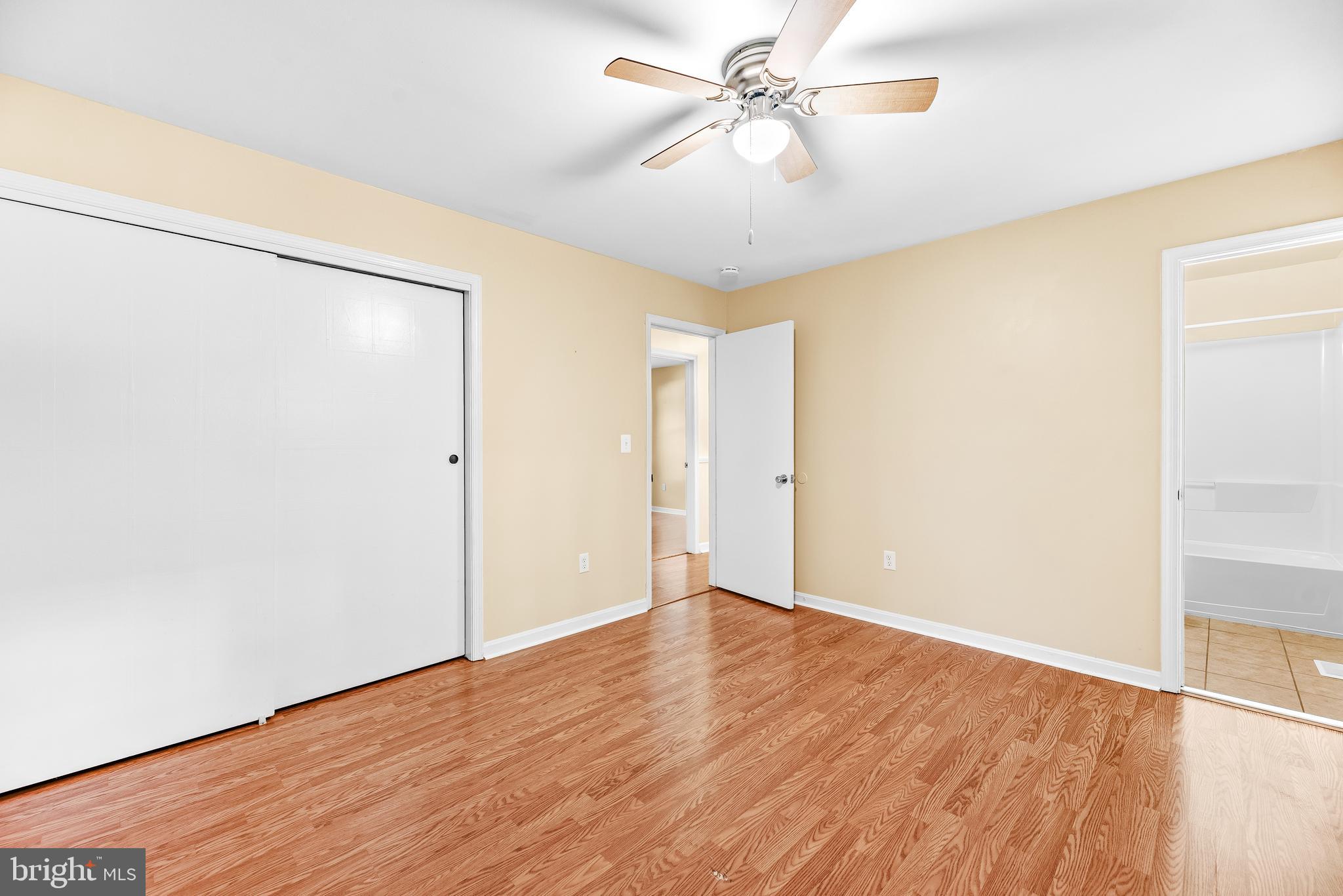 1730 Holland Cliffs Road Huntingtown, MD 20639 - Photo 21 of 46 Primary Bedroom w/ wood floors