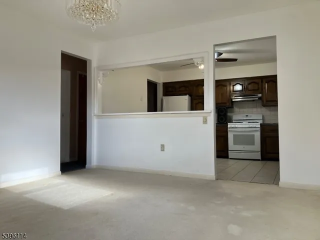 a view of a kitchen with an oven and a refrigerator