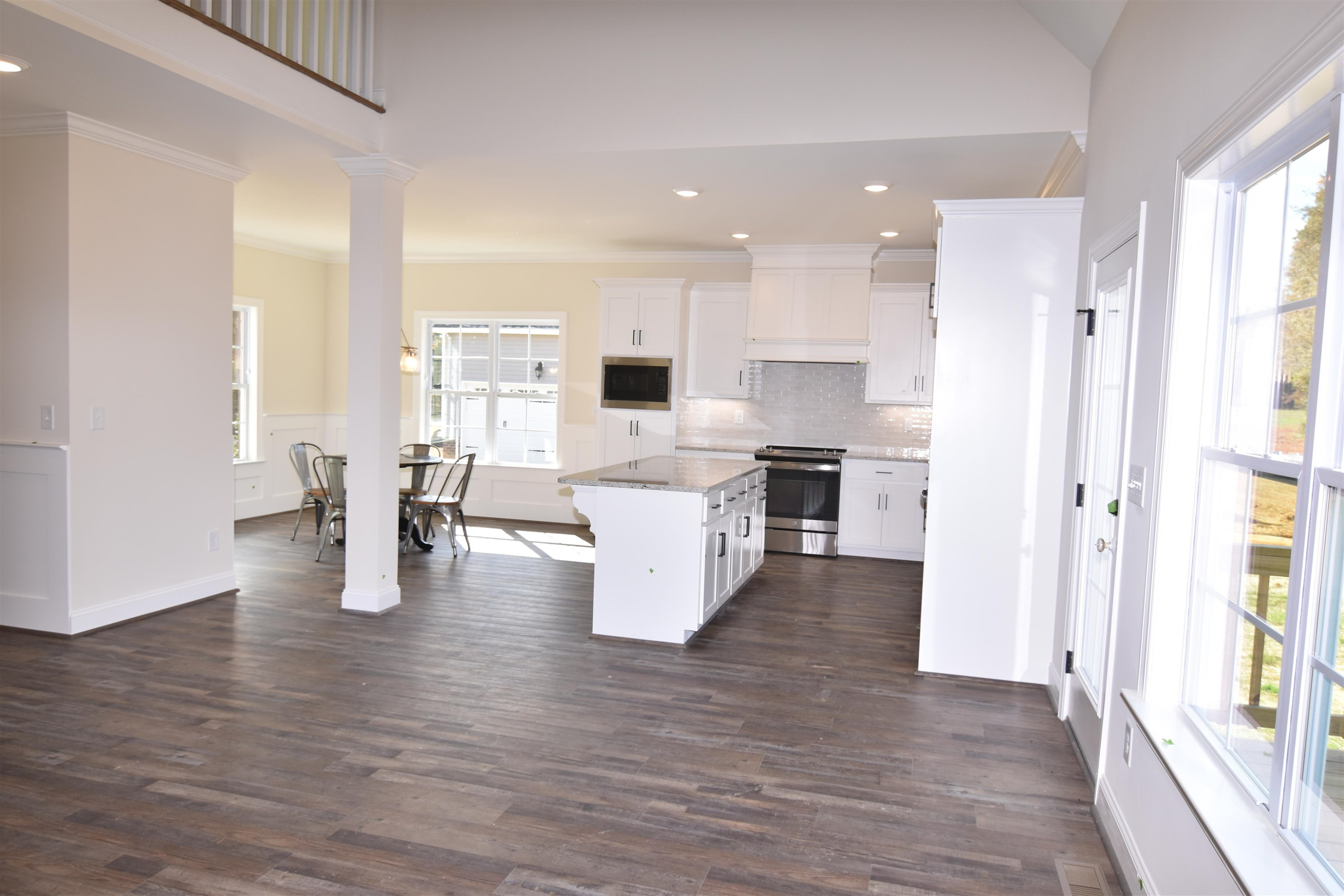 1130 Green Road Spring Hope, NC 27882 - Photo 9 of 30 a view of kitchen with kitchen island stainless steel appliances wooden floor and window