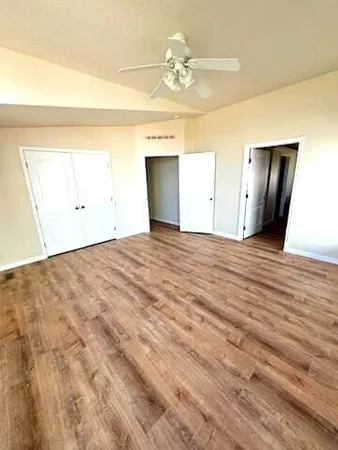 a room with closet and wooden floor