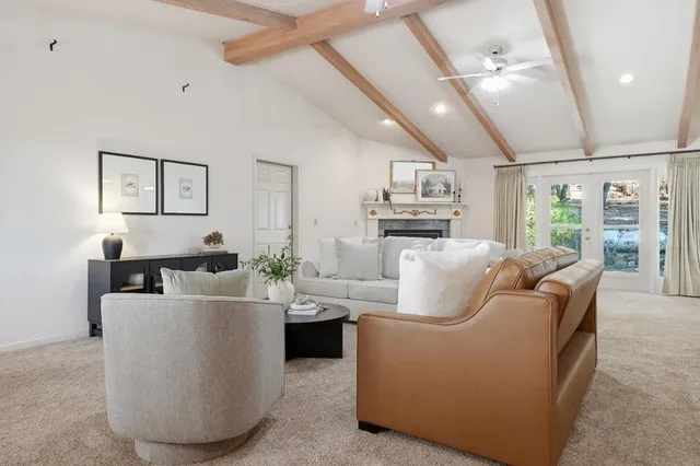 a living room with a fireplace and a window
