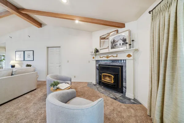 a kitchen with a stove a sink and a counter space