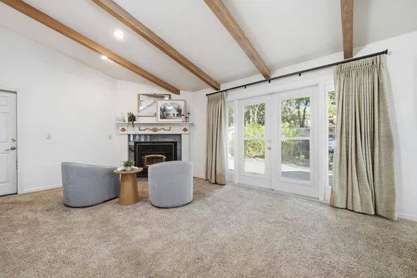 a kitchen with stainless steel appliances a stove a sink and a microwave