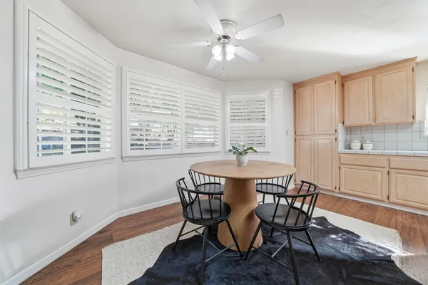 a kitchen with stainless steel appliances granite countertop a sink and a refrigerator