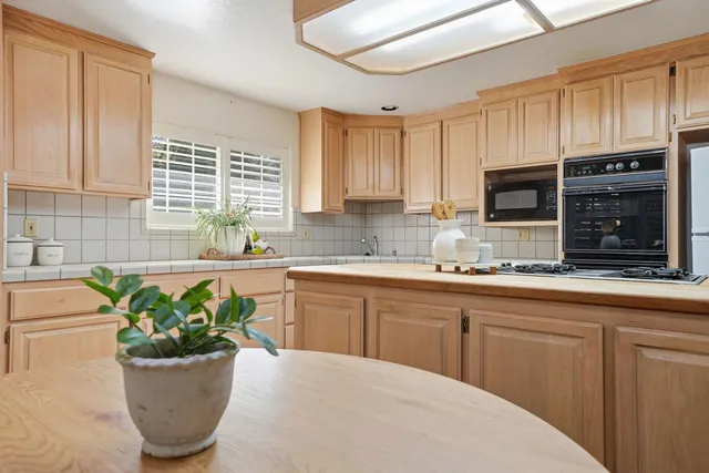 a bedroom with a bed and a potted plant