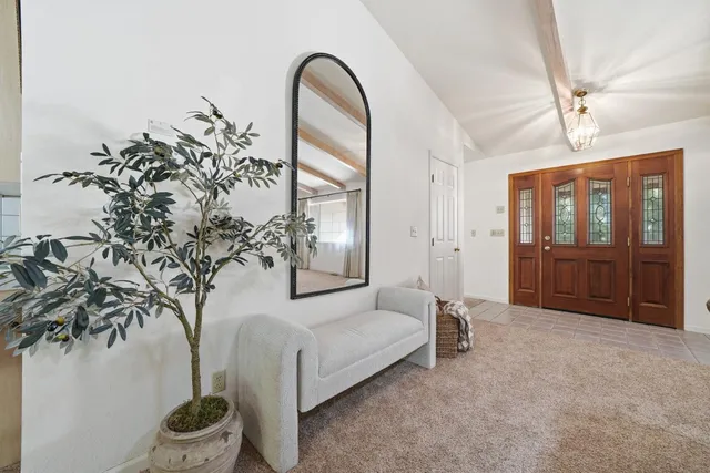 a view of a wooden fence and trees