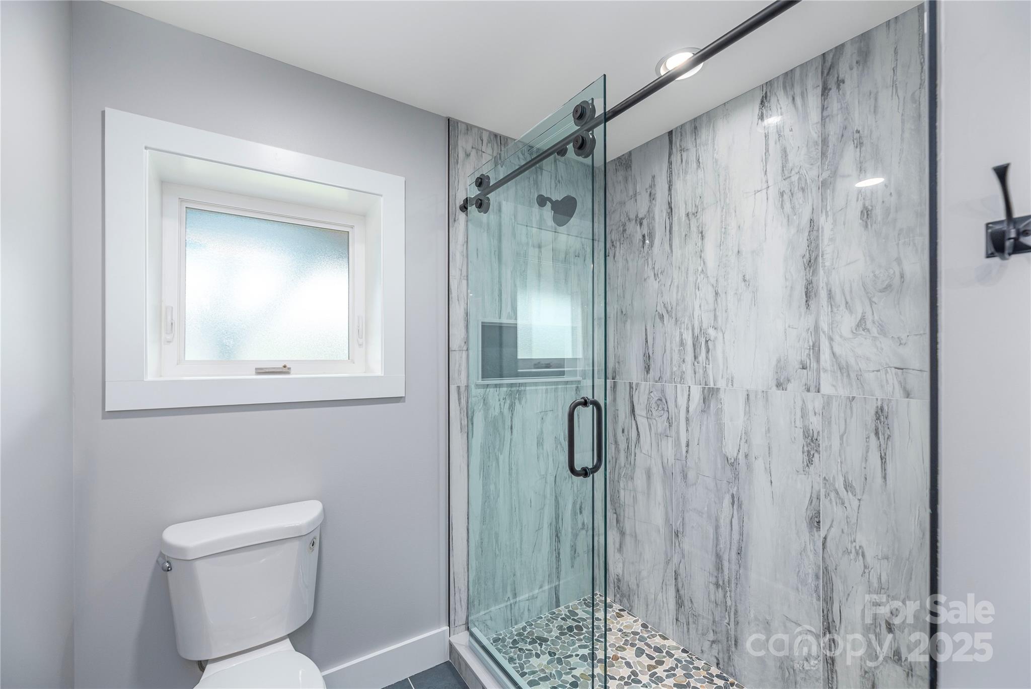 234 Erwin Hills Road Asheville, NC 28806 - Photo 17 of 47 a bathroom with a shower a toilet and sink