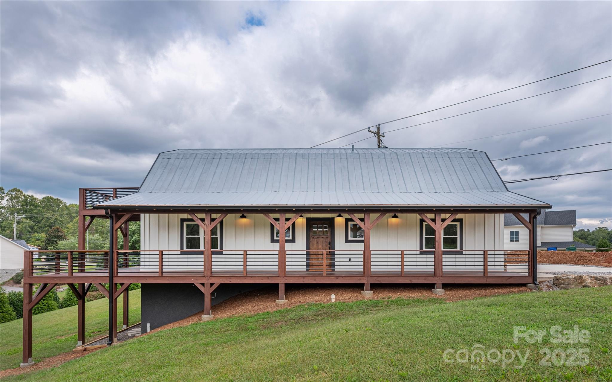 234 Erwin Hills Road Asheville, NC 28806 - Photo 2 of 47 a backyard of a house with barbeque oven table and chairs