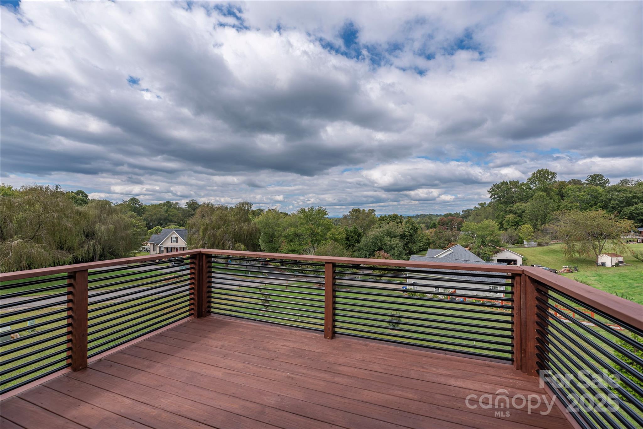 234 Erwin Hills Road Asheville, NC 28806 - Photo 22 of 47 a view of a balcony with wooden floor and fence
