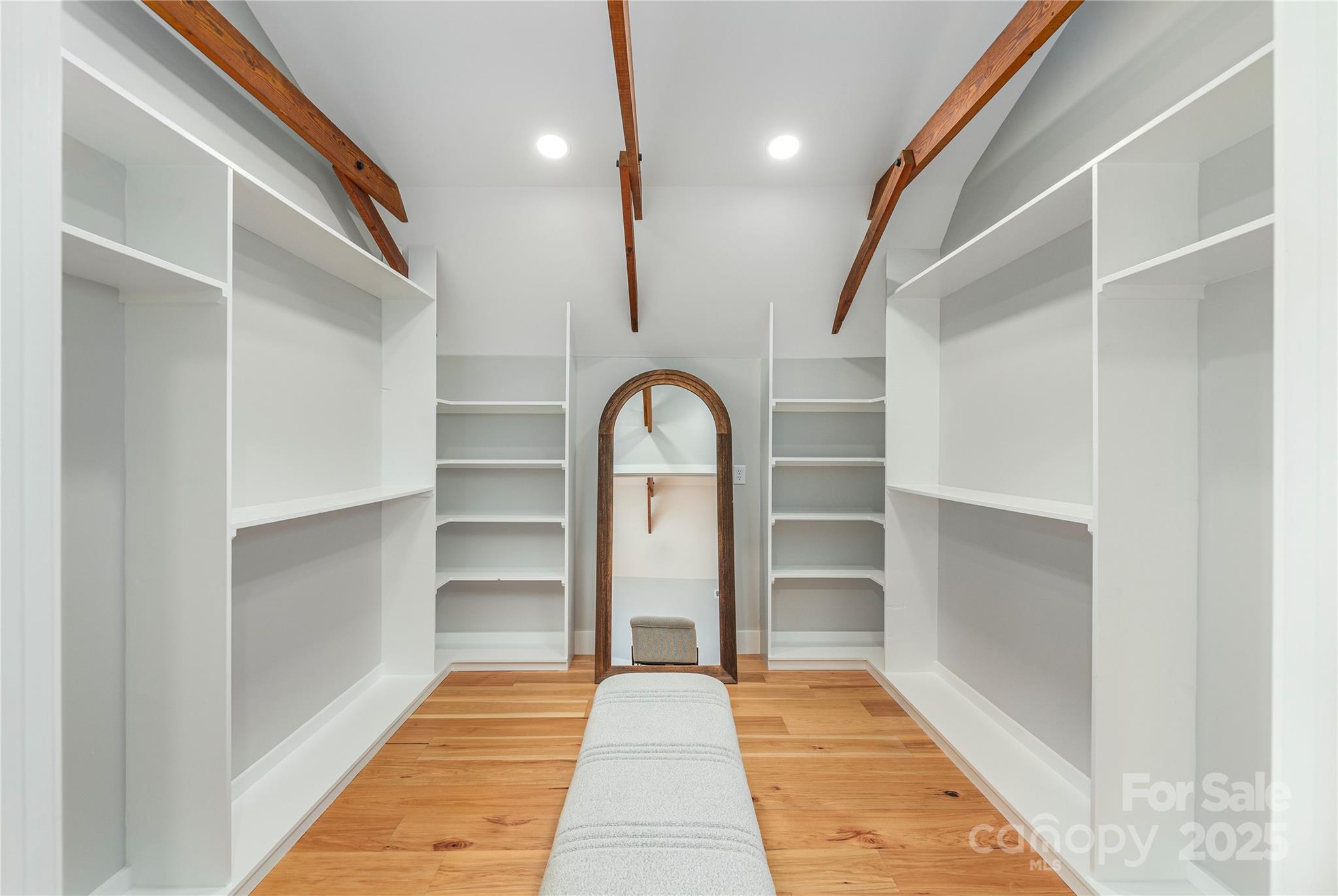 234 Erwin Hills Road Asheville, NC 28806 - Photo 23 of 47 a room with a walk in closet and wooden floor